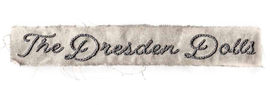 Beige fabric banner with dark gray rope-stitched text reading 'The Garden Dad'.